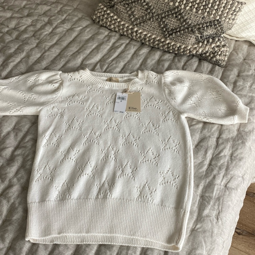 Off white sweater with stars.